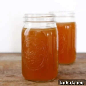 Homemade Chicken Broth in mason jars, showcasing its rich, golden color, a perfect base for any meal.
