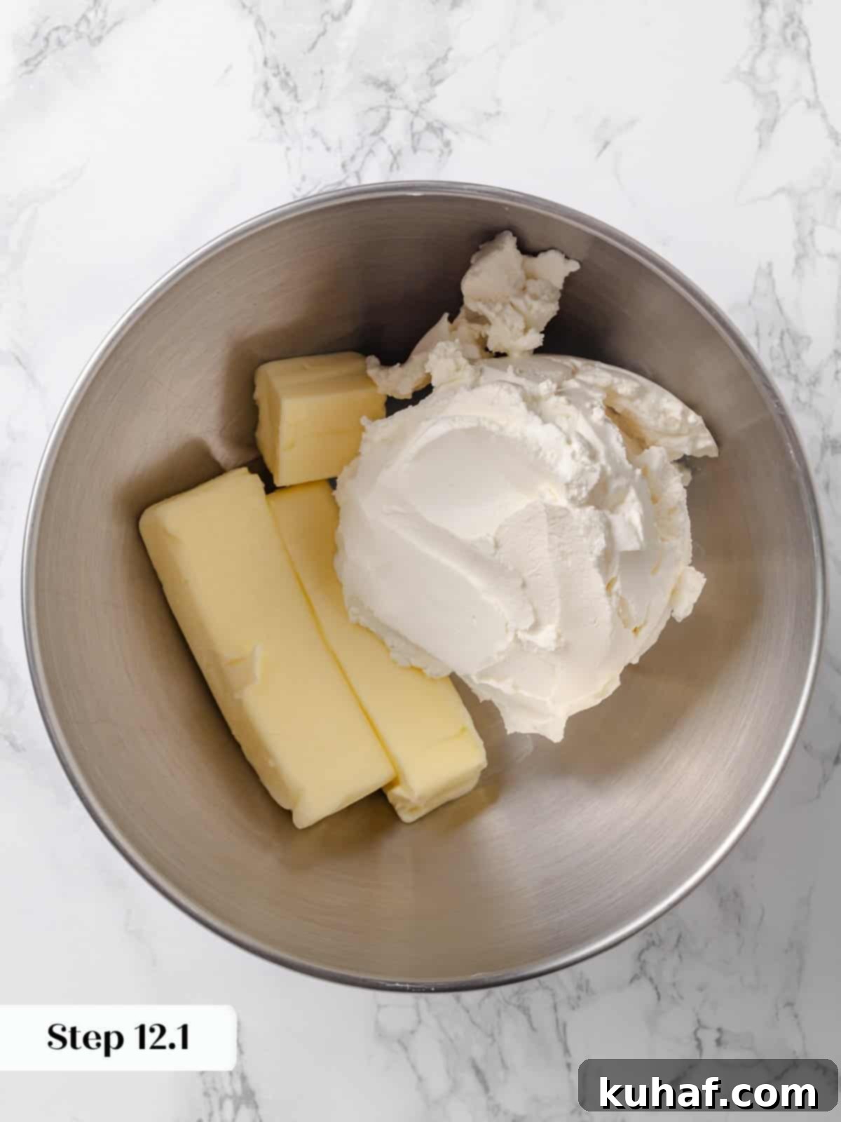 Butter and cream cheese in a mixer bowl before blending, at room temperature.