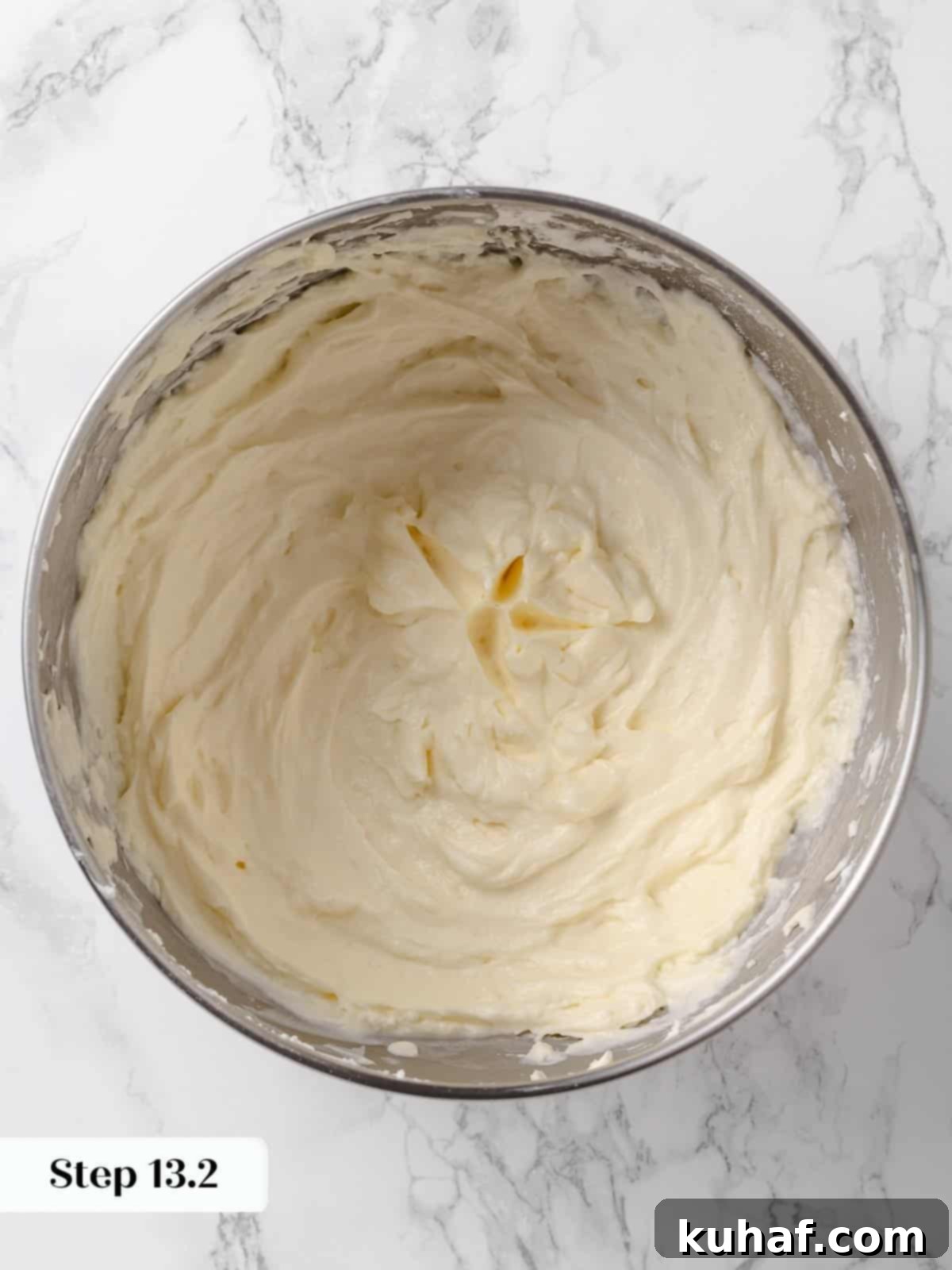 Bowl of smooth, fluffy cream cheese buttercream, perfectly mixed.