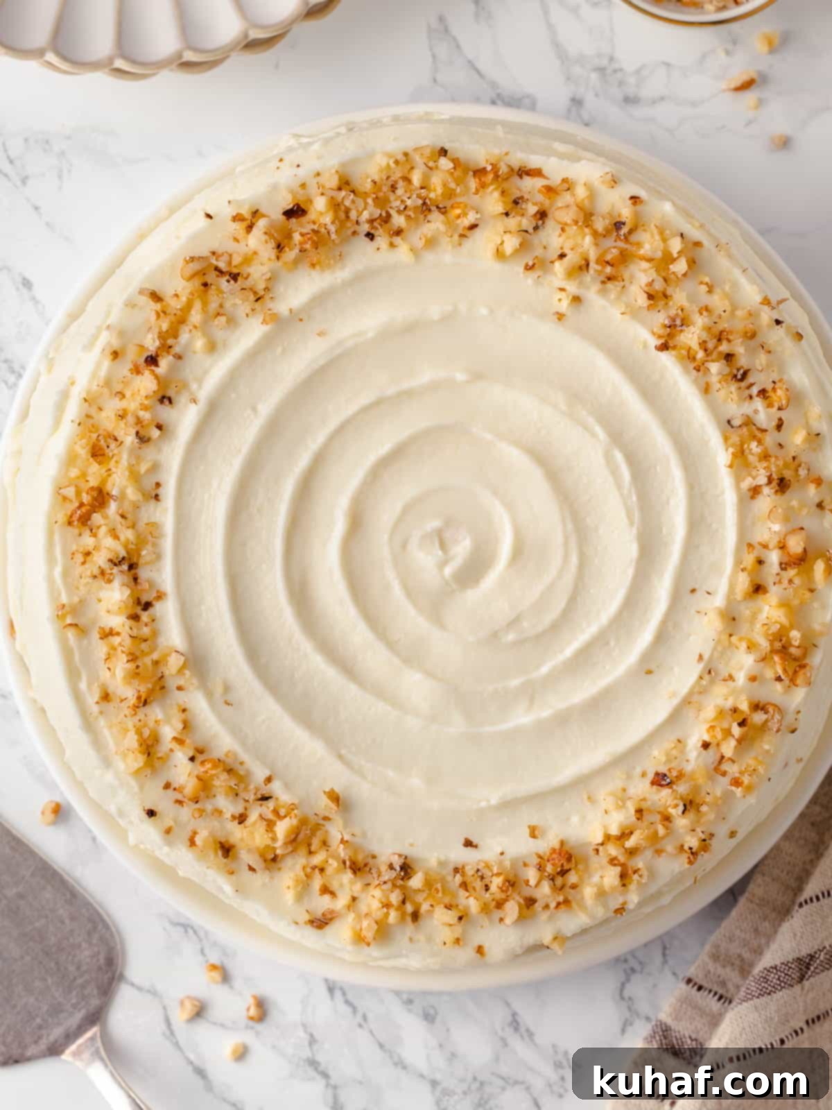 Overhead view of a beautifully smooth frosted carrot cake top.