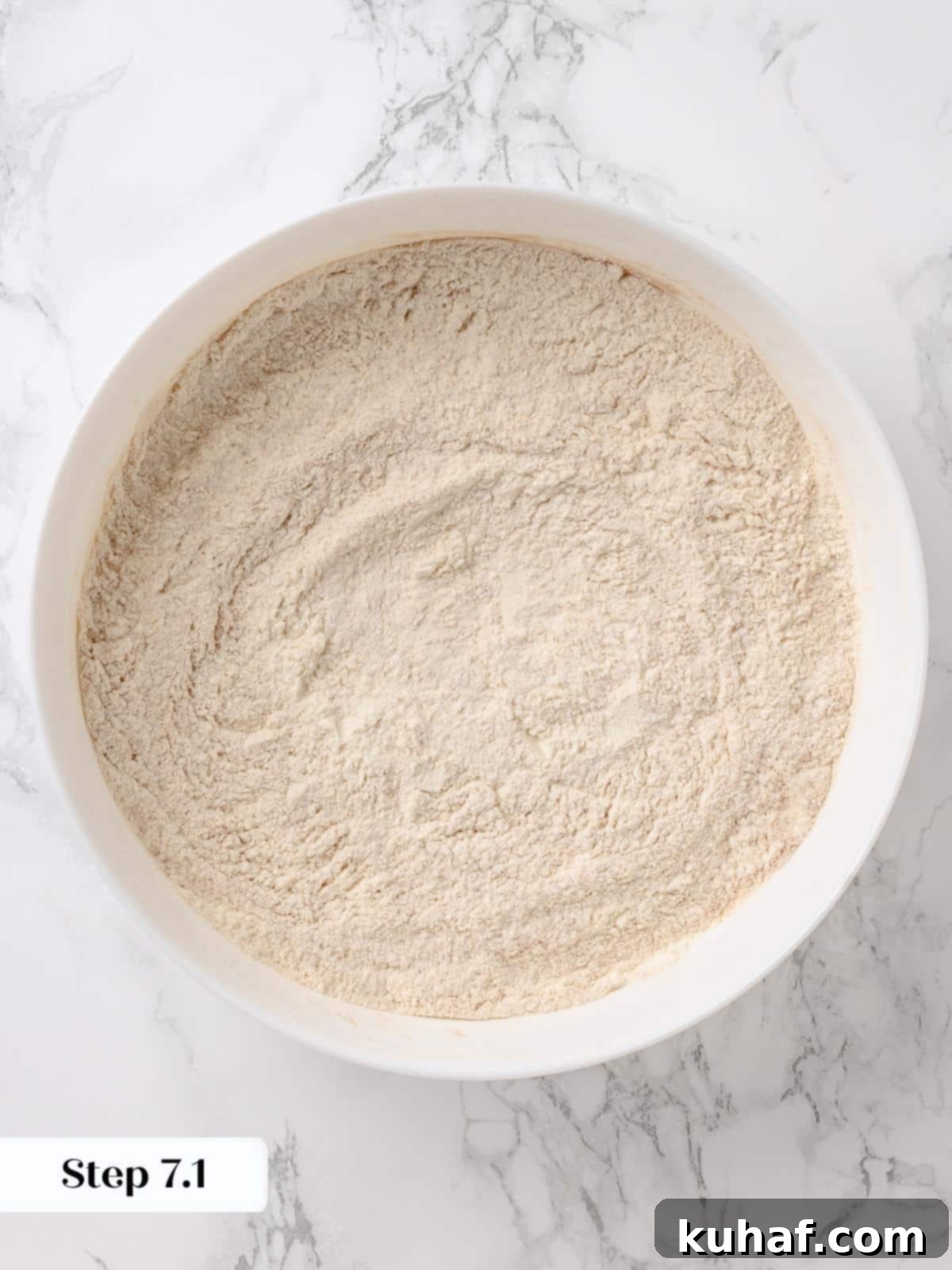 Bowl of flour, baking soda, baking powder, and spices mixed together.