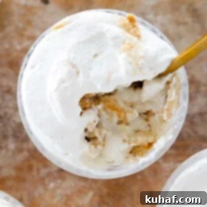 Banana Pudding in dish with gold spoon