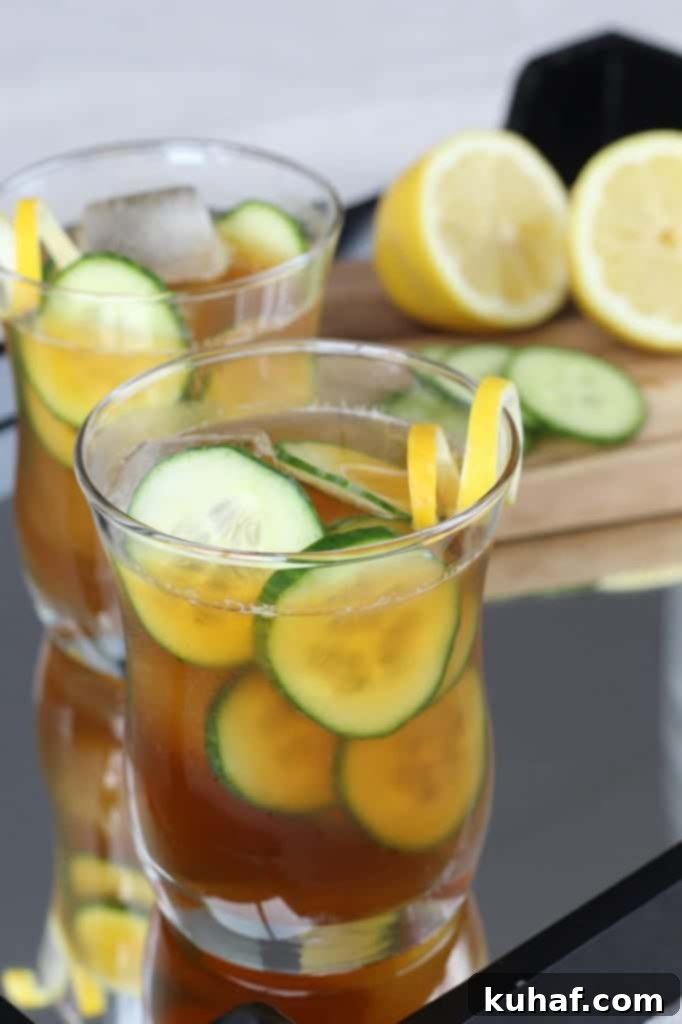 Cucumber Pimms Cooler 5 A beautifully prepared Cucumber Pimm's Cup in a tall glass, garnished perfectly.