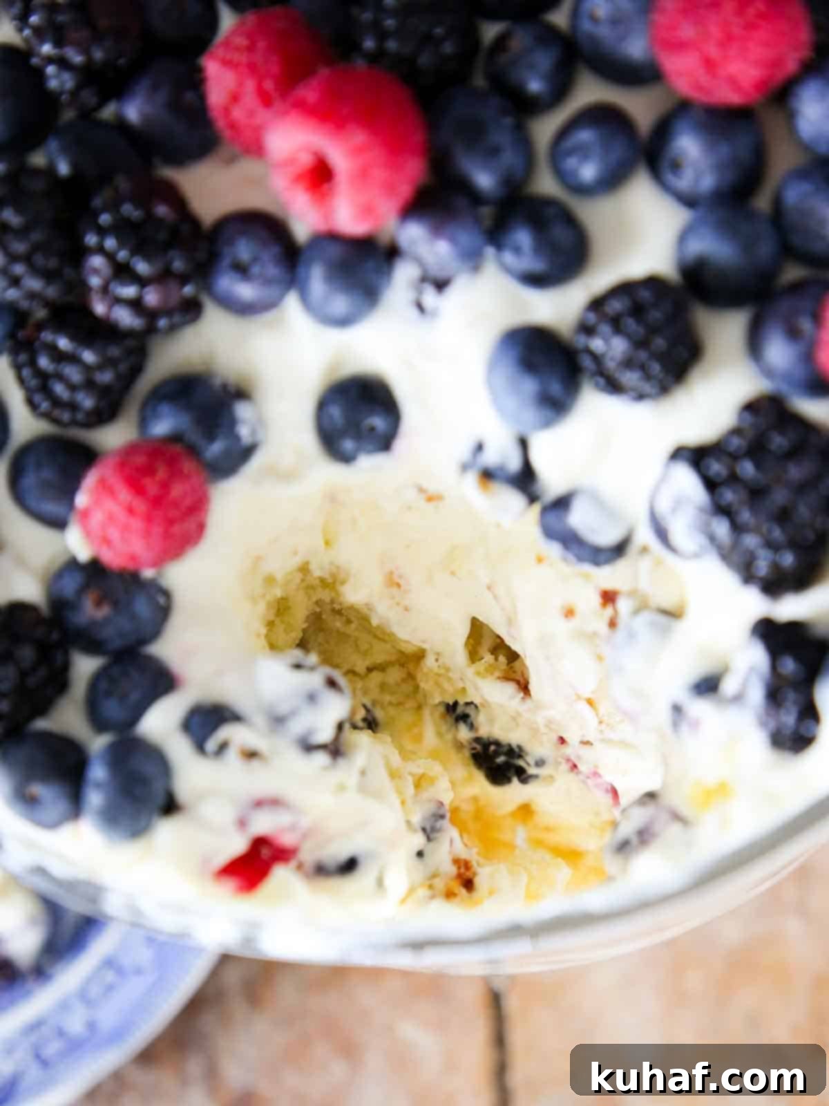 top of trifle dish loaded with berries scooped .out.