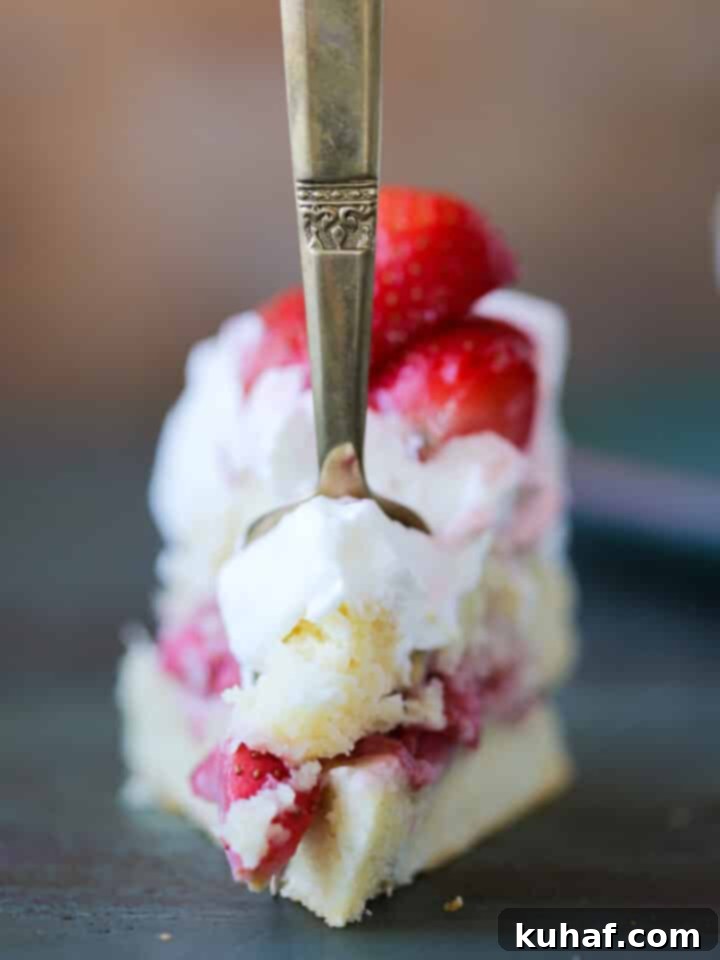 Old Fashioned Strawberry Shortcake slice close up with gold fork
