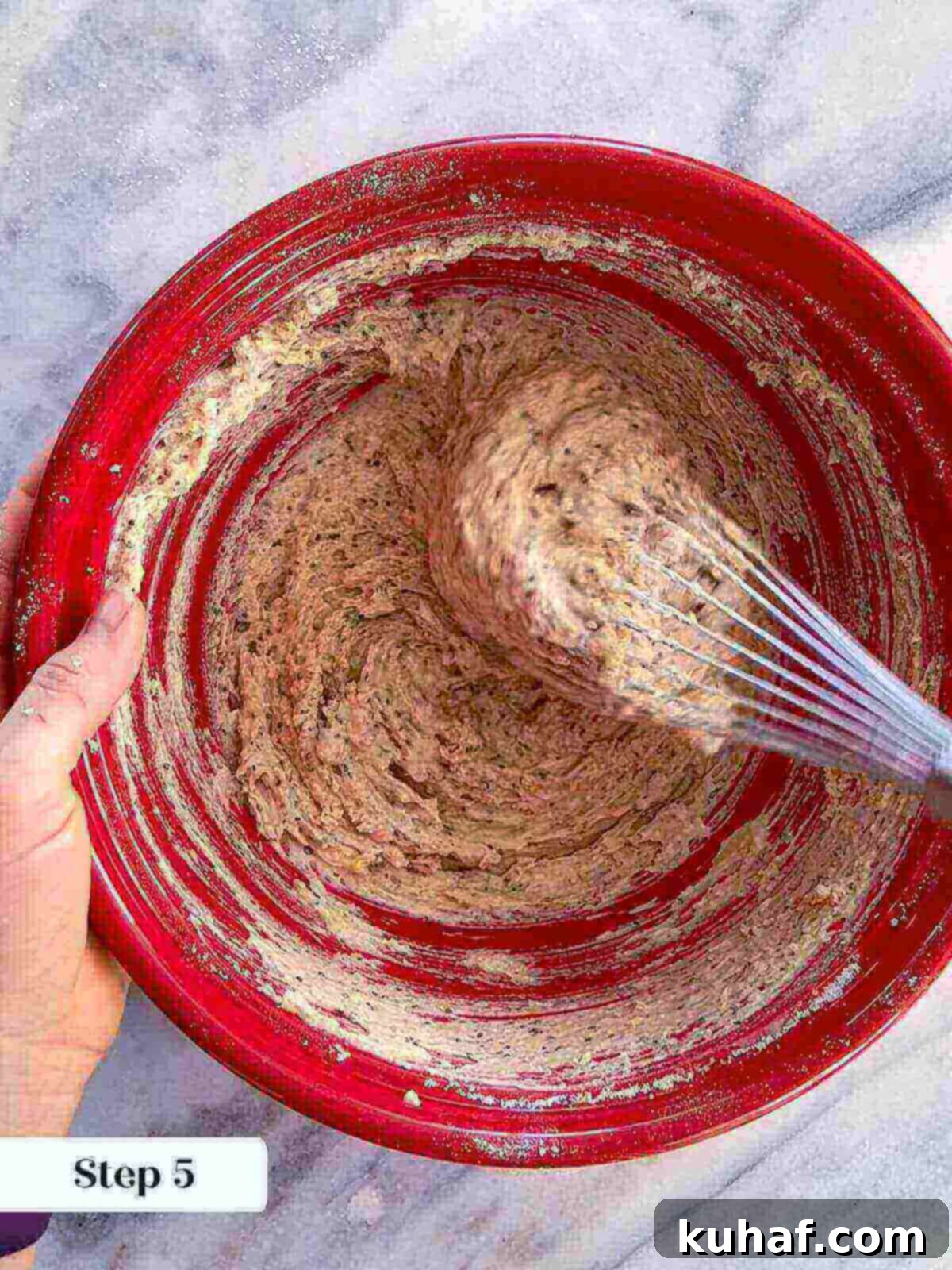 Delicious Strawberry Muffins 7 The fully mixed strawberry muffin batter, showing its shaggy consistency, ready for the fresh fruit to be folded in.