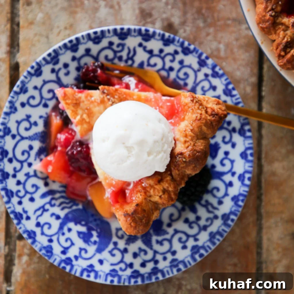 Peach Blackberry Pie with a scoop of vanilla ice cream