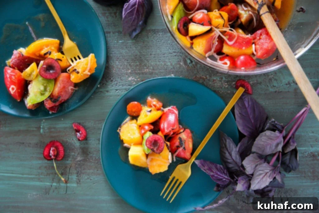 Close-up of Marinated Tomato Stone Fruit Salad, showcasing fresh basil and shallots