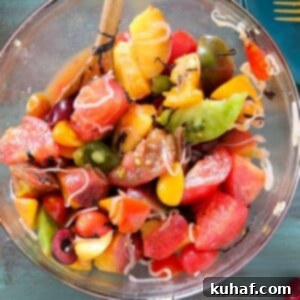 Marinated Tomato Stone Fruit Salad in mixing bowl