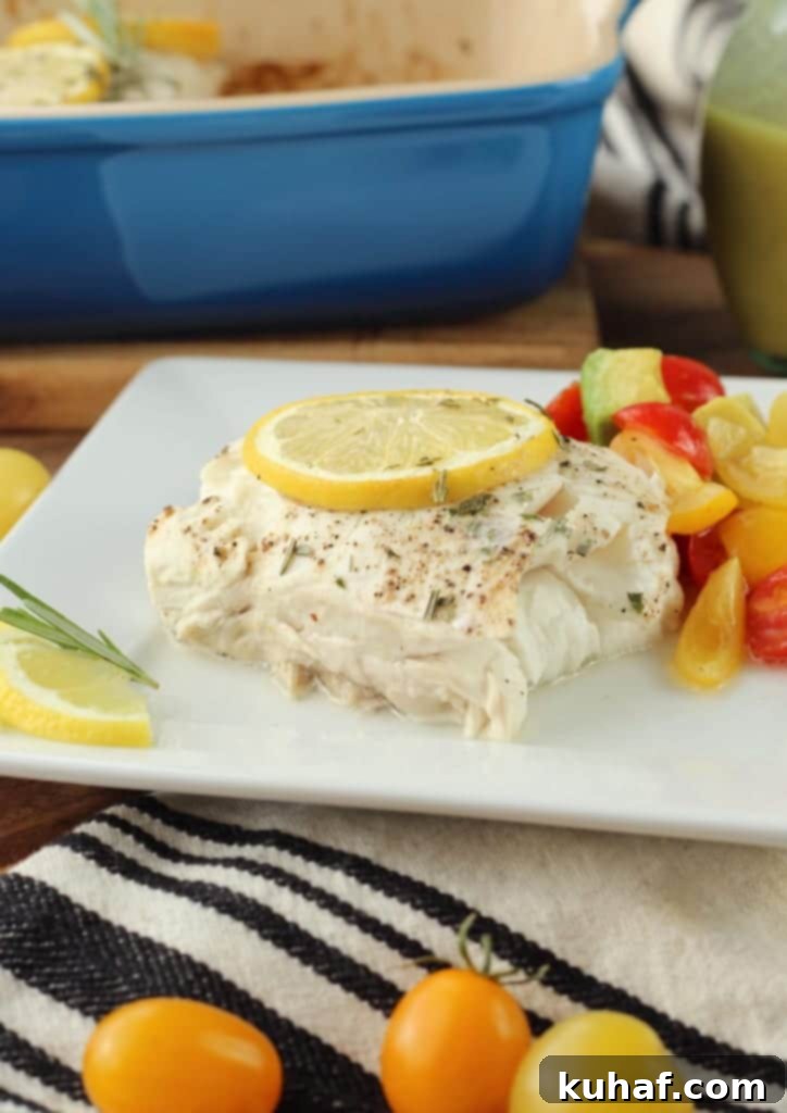 Flaky Baked Halibut with Bright Champagne Vinaigrette 2 Perfectly Baked Halibut fillet garnished with lemon and rosemary