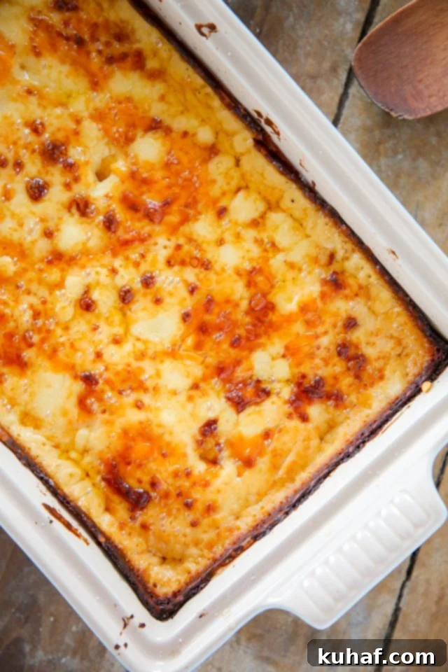 Close-up of Scalloped Potatoes with a serving spoon