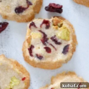 A perfectly baked whole Pistachio Cranberry Sablee Cookie, ready to be devoured.