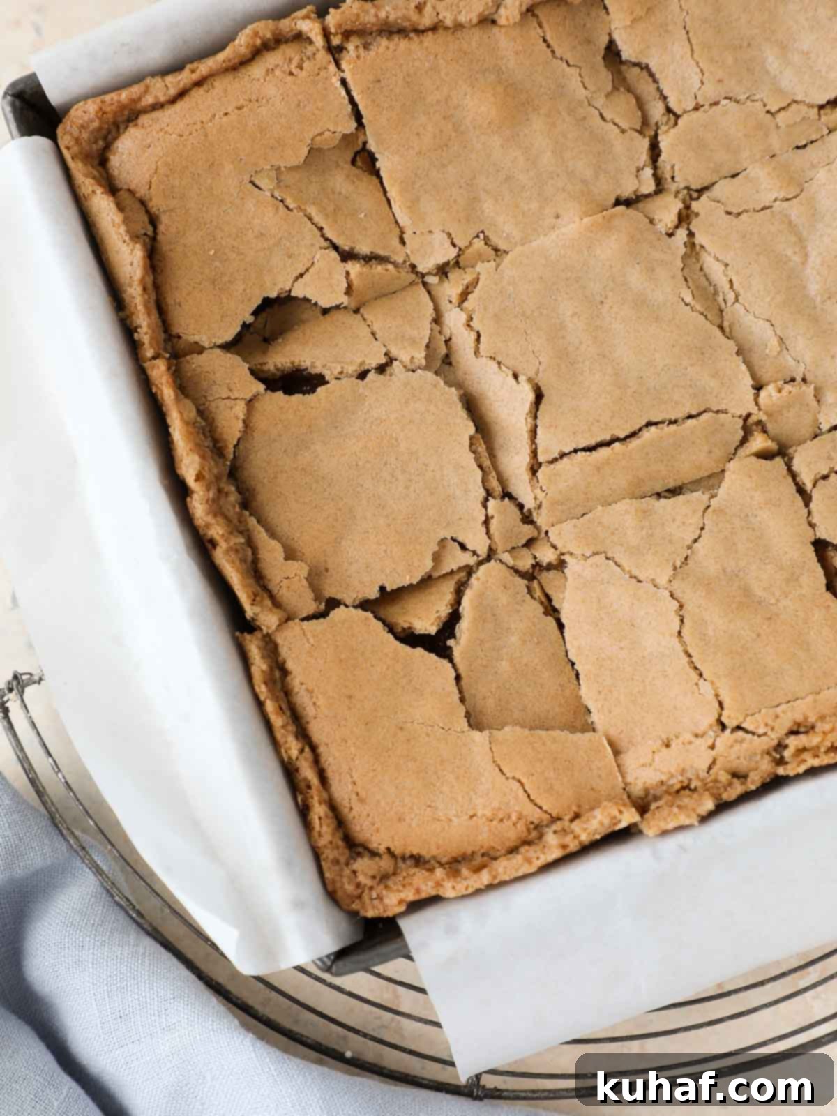 sliced butterscotch brownies in pan on cooling rack. 