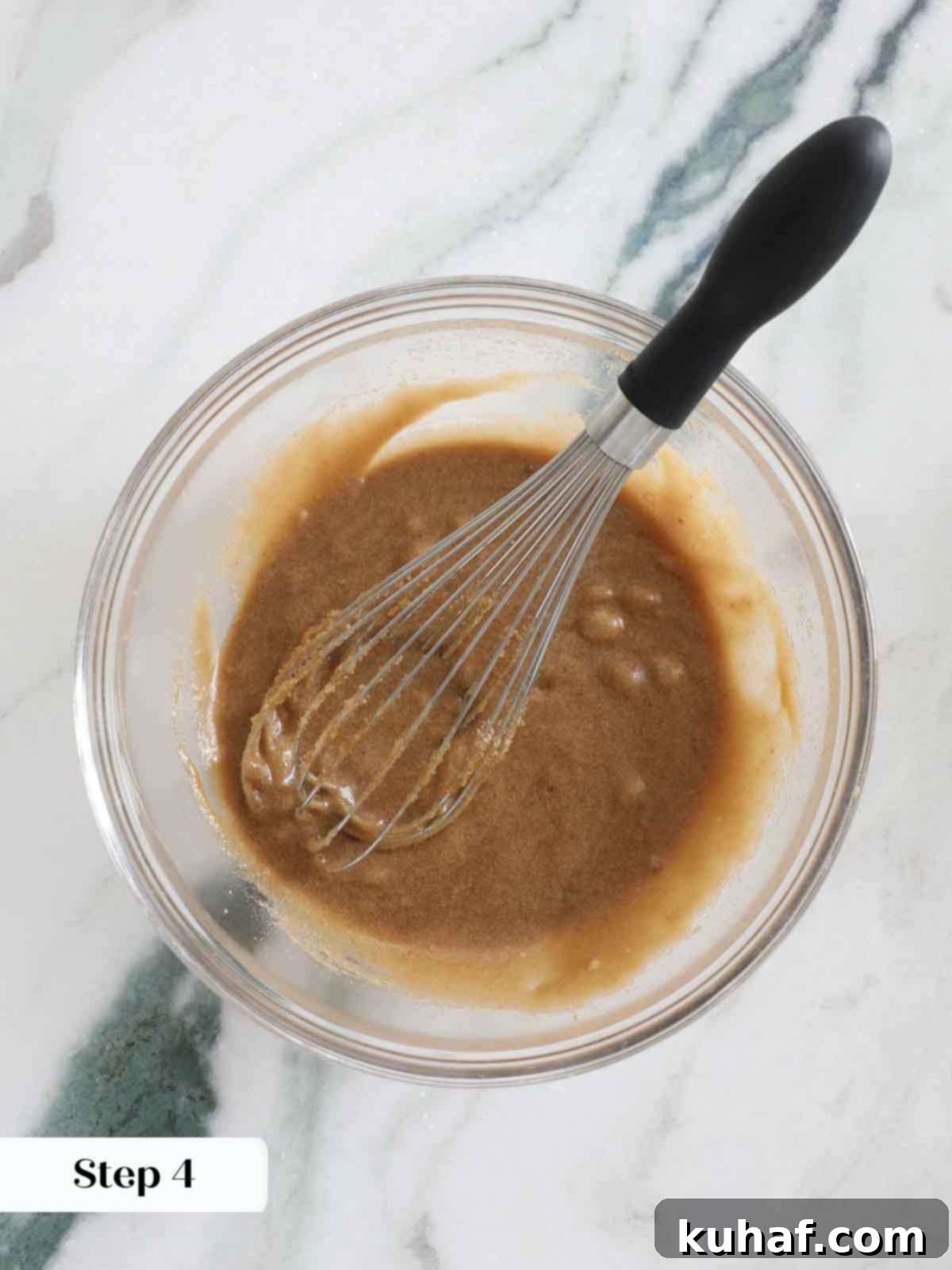 wet ingredients whisked in bowl for butterscotch brownies.
