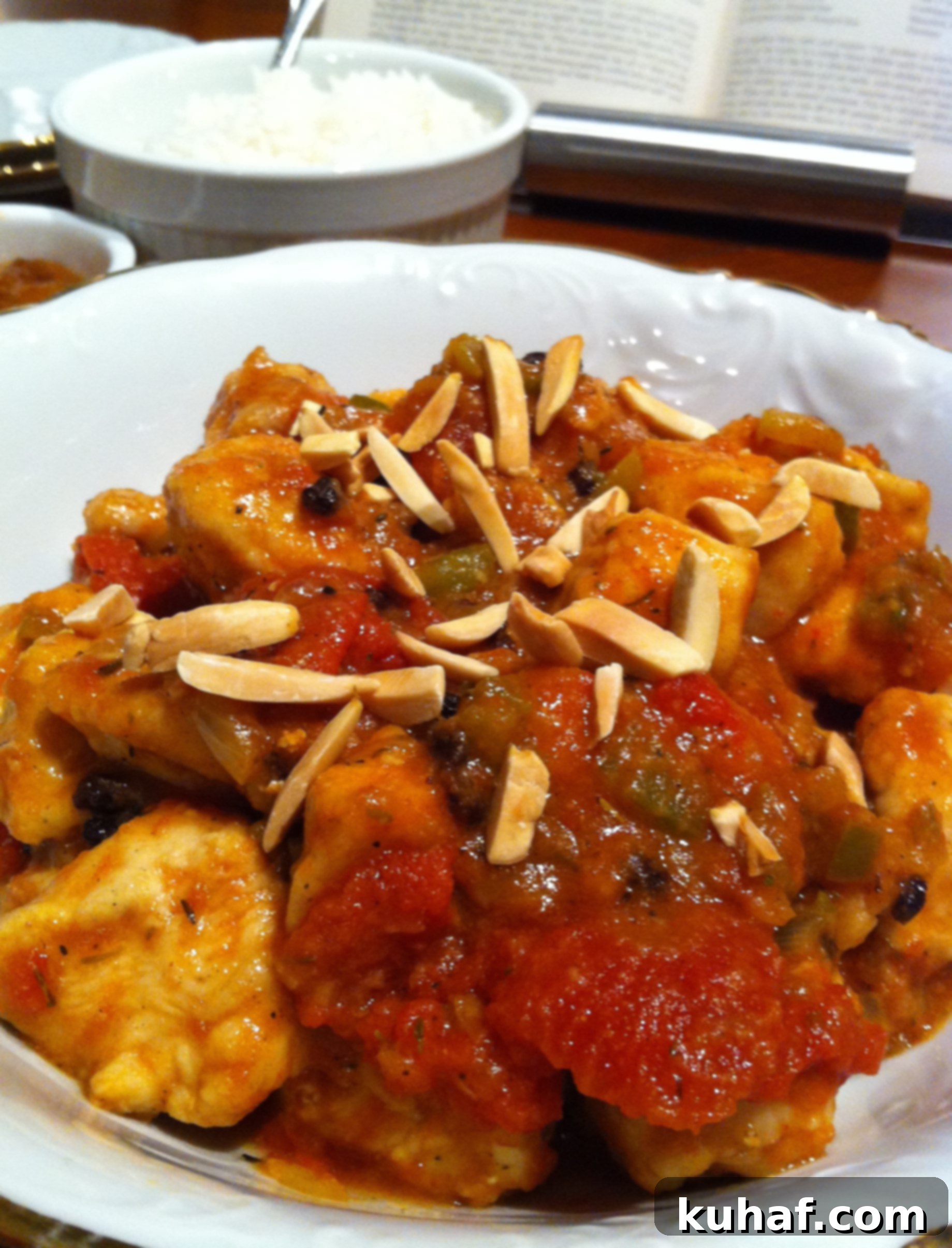Country Captain Chicken Curry A Culinary Heritage 4 Serving of Country Captain Chicken Curry with rice and almonds