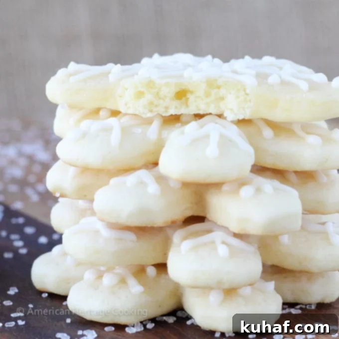 soft sugar cookies shaped like snowflakes stacked.