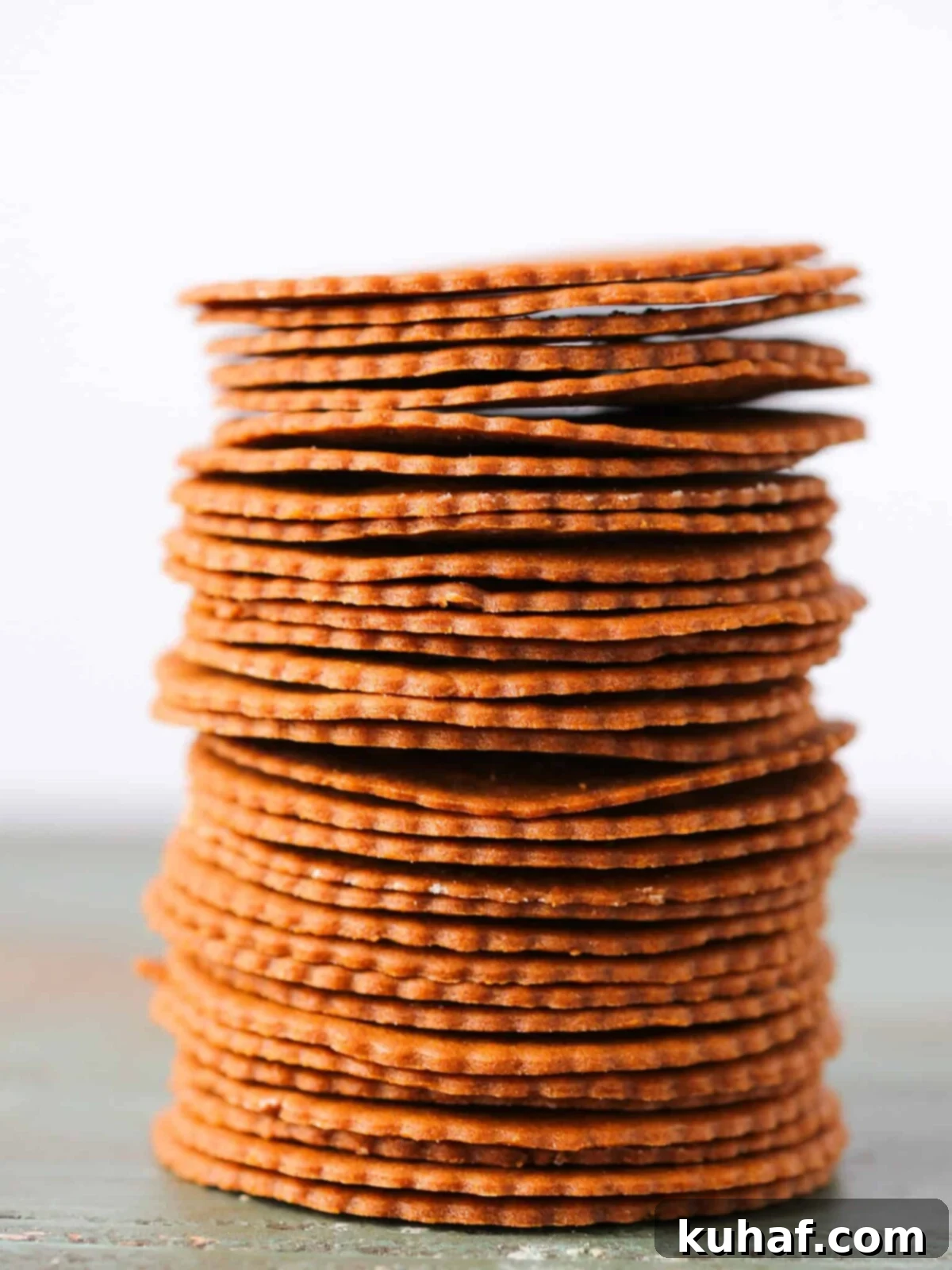 Moravian Christmas Cookies stacked tall white background.