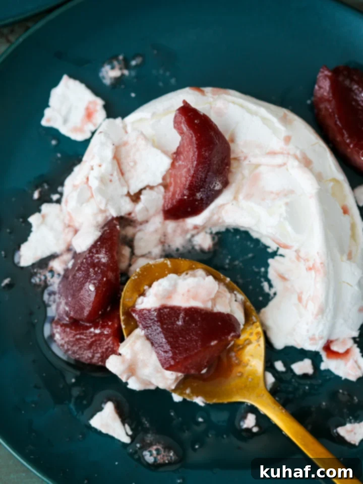 Individual Poached Pear Pavlovas arranged elegantly on a serving dish.