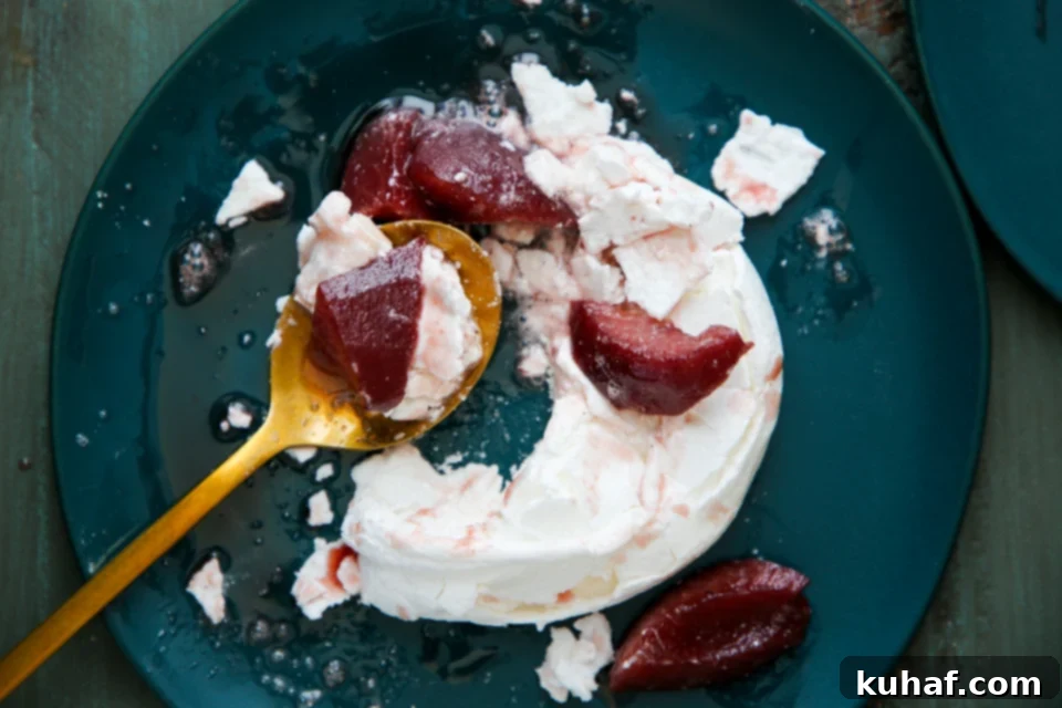 A beautifully composed shot of Poached Pear Pavlova from a top-down angle.