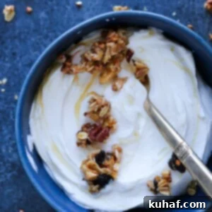 Honey Granola on yogurt in blue bowl