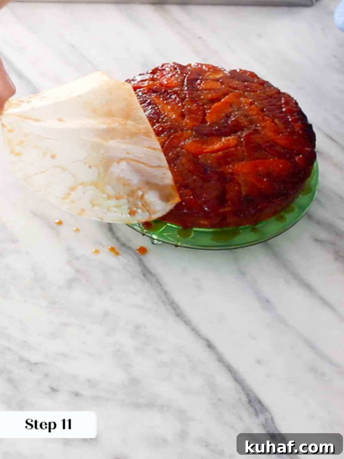 removing parchment from top of upside down cake.
