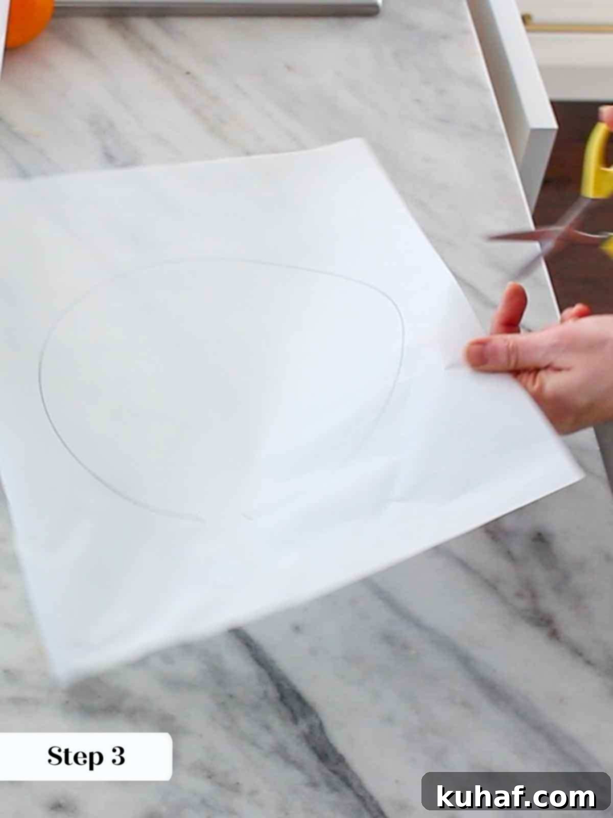 cutting parchment circle.