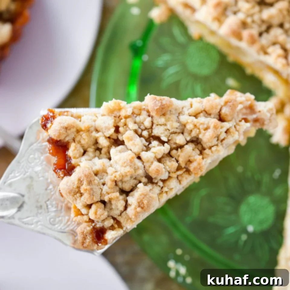 A close-up view of the streusel topping on the Caramel Apple Tart, textured and golden.