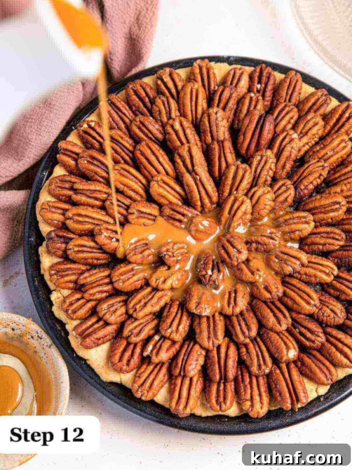 Step 12: Drizzling warm, golden caramel sauce generously over a perfectly baked chocolate pecan pie, adorned with pecans.