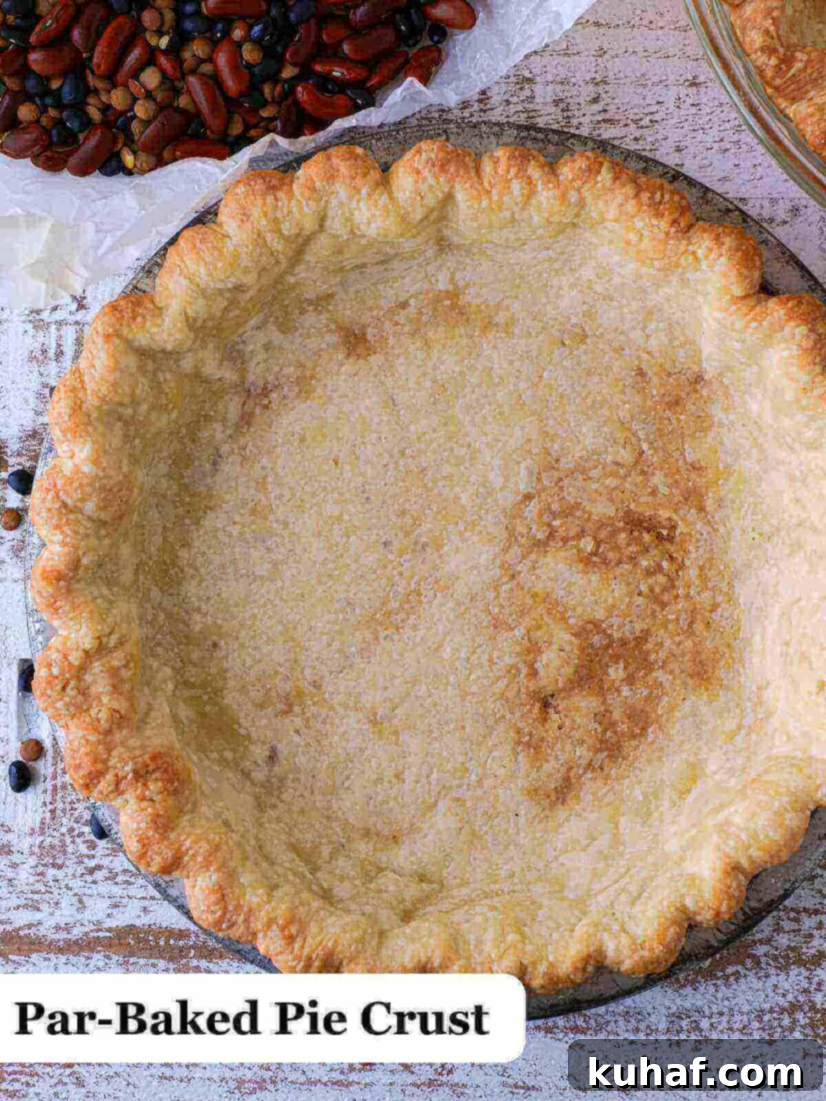 A perfectly par-baked pie crust, golden and crisp, ready for its delicious filling.