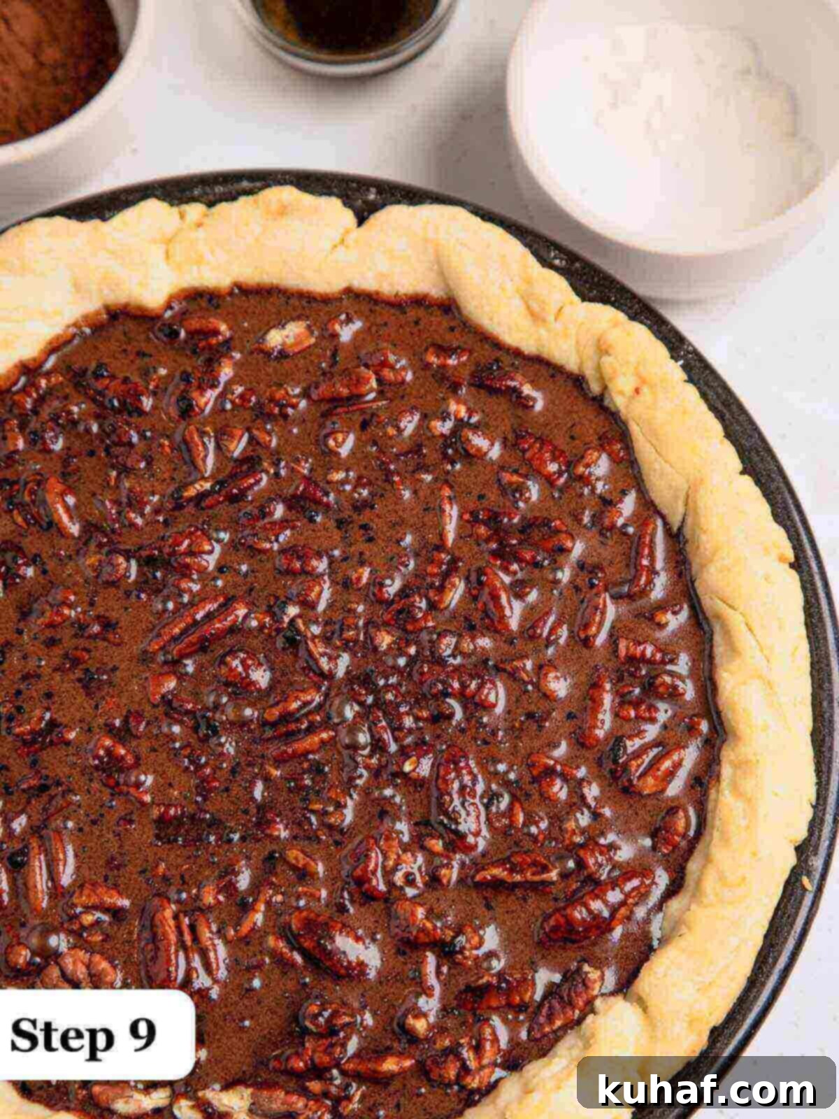 Step 9: The freshly baked chocolate pecan pie, glistening and warm, out of the oven and beginning to set on a cooling rack.
