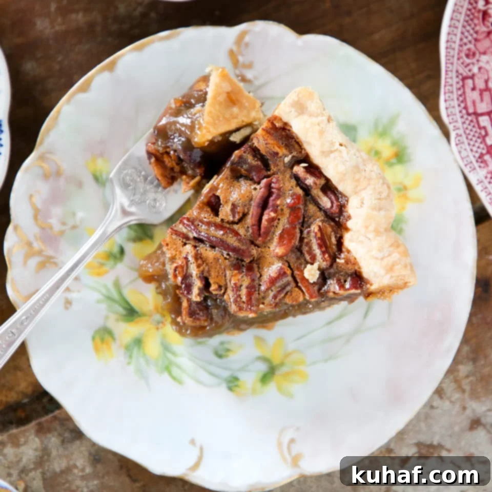 Classic Pecan Pie slice on plate with yellow flowers