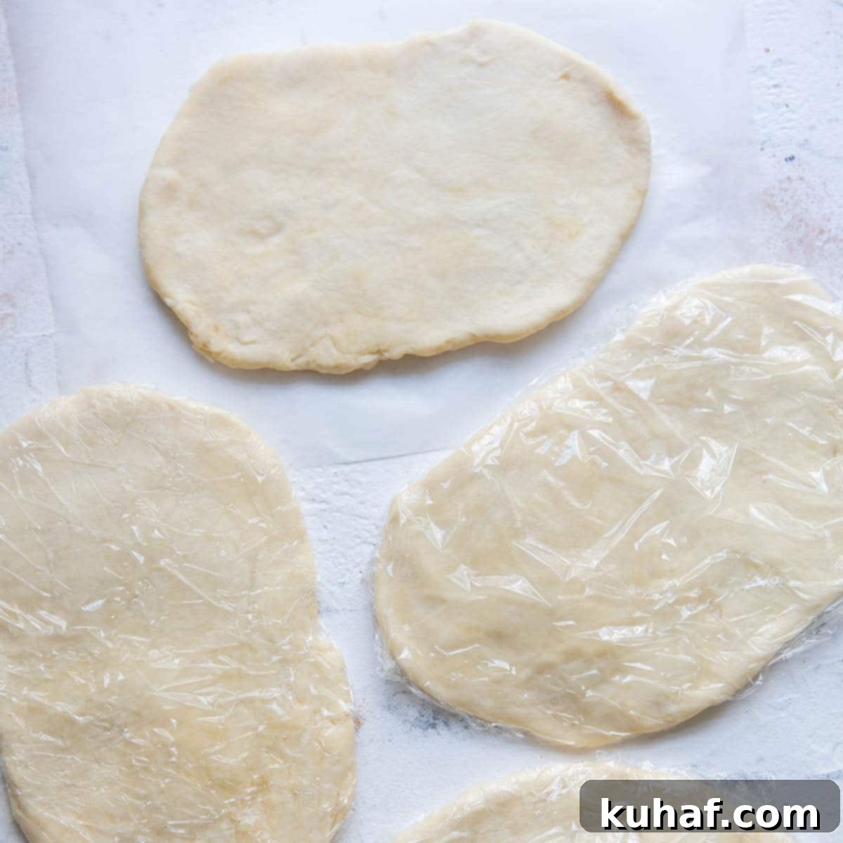 cream cheese dough wrapped in plastic wrap.
