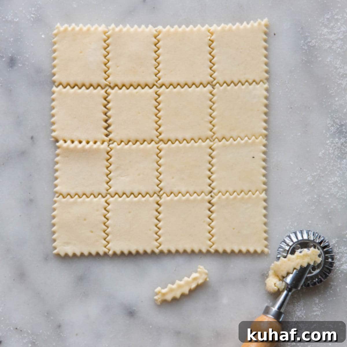 nut roll dough rolled sliced in squares with pastry cutter.