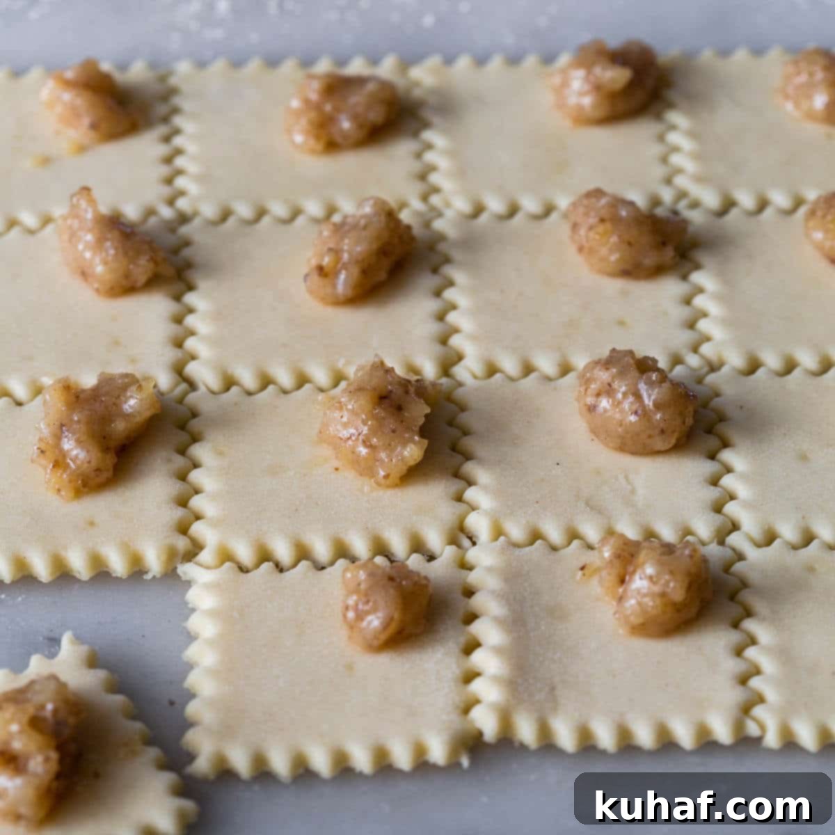 walnut filling on dough squares.