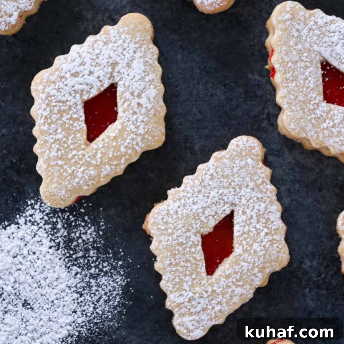 sandwich cookies in diamond shape with raspberry jam filling.