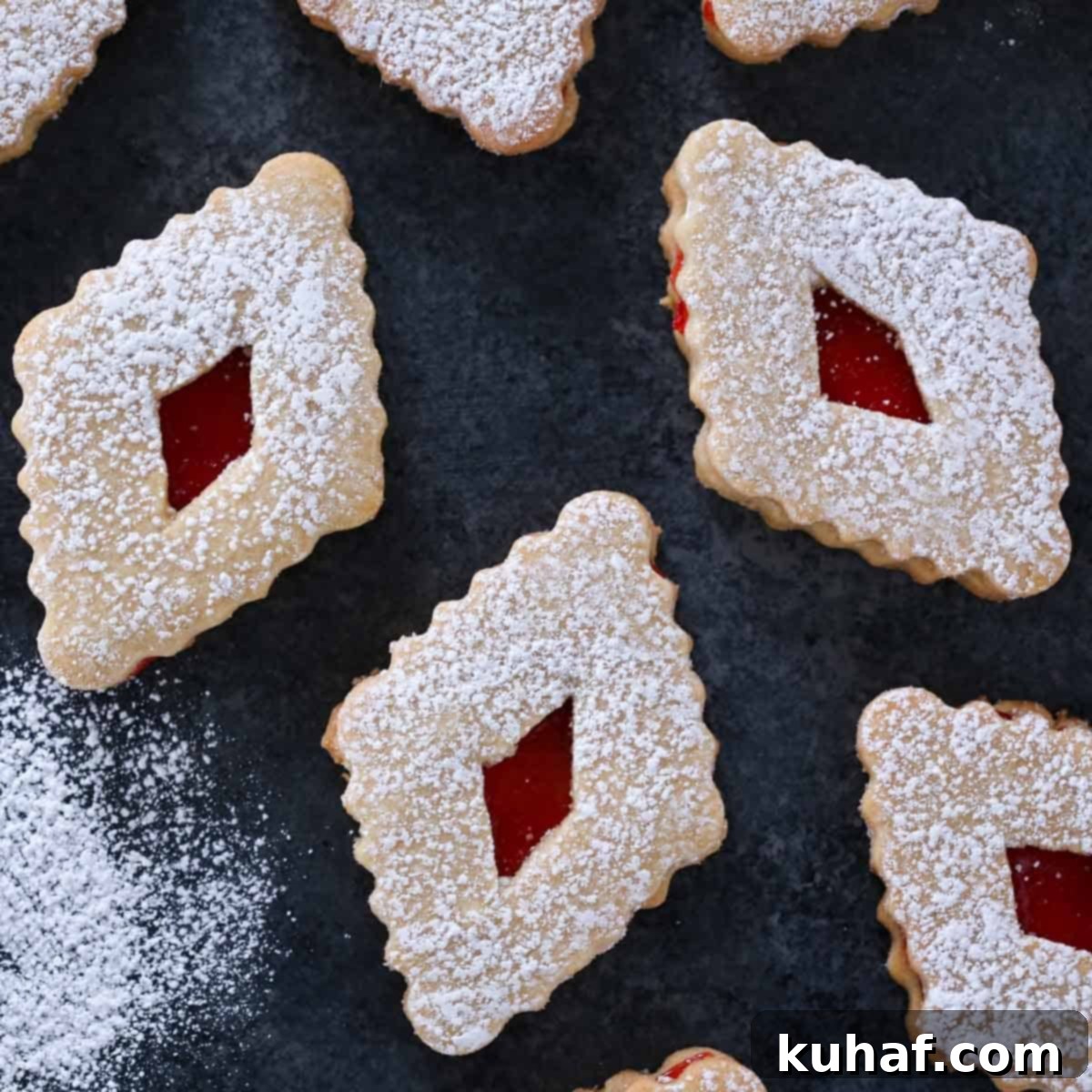 linzer cookies on black background.