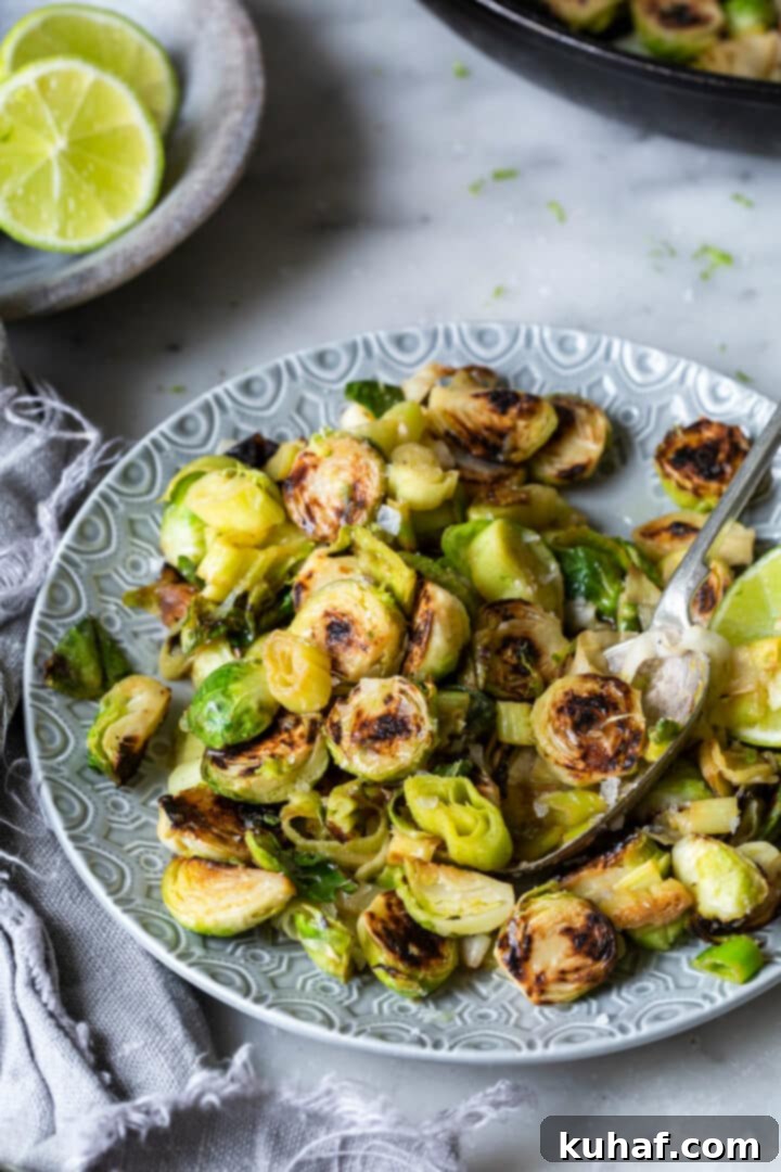 Brussels Sprouts and Leeks with Lime ginger butter plated on grey plate