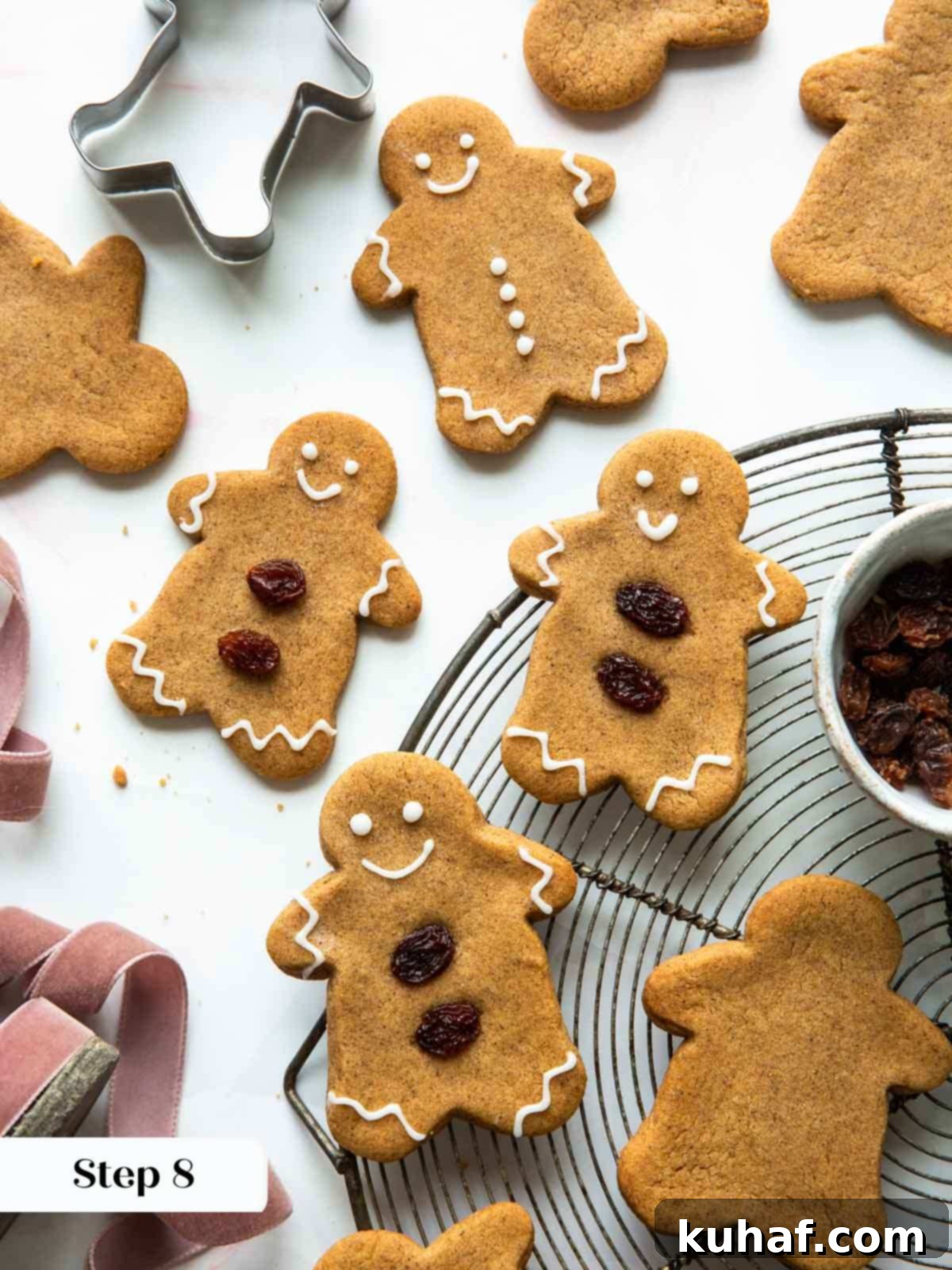A batch of baked and beautifully decorated gingerbread cookies, ready for serving.