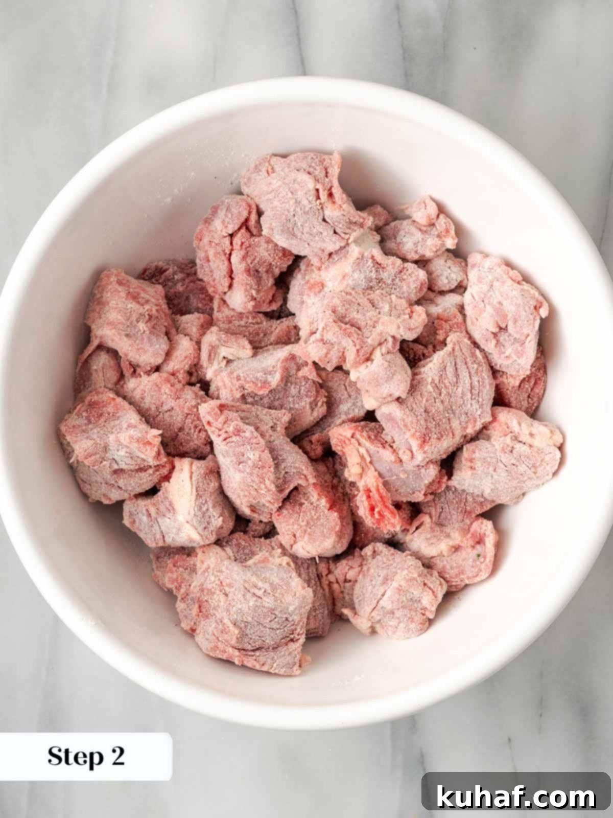 Flour-coated stew meat, ready for browning.