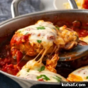 Sun-Kissed Marinara Chicken 13 cheesy chicken being served from pot.