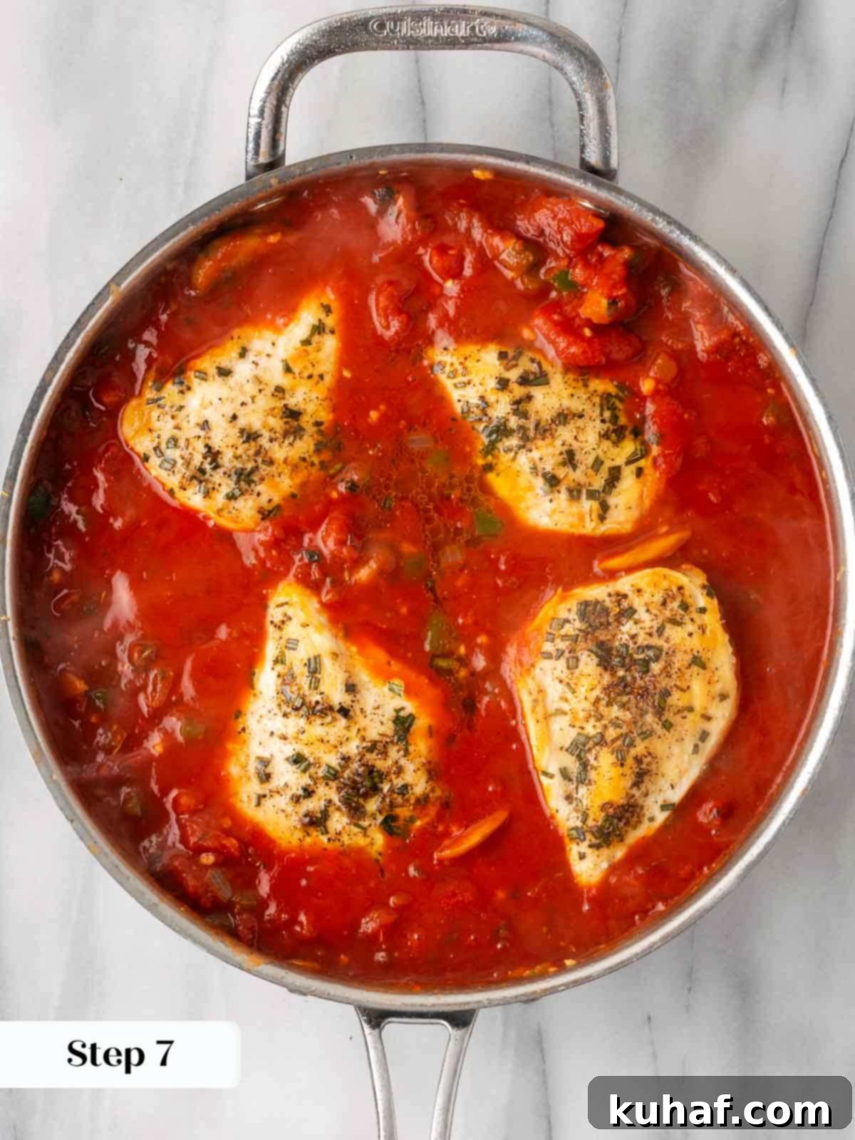 Sun-Kissed Marinara Chicken 10 chicken baking in marinara in pan.