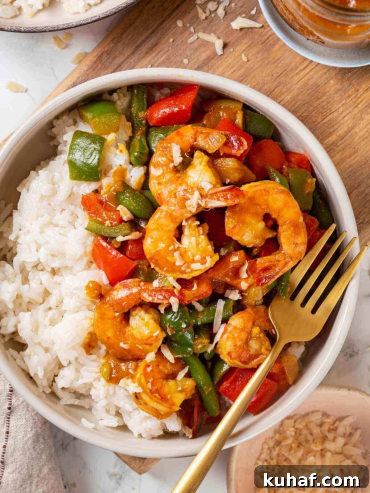 Delicious shrimp curry served beautifully on a wooden table, inviting to eat.