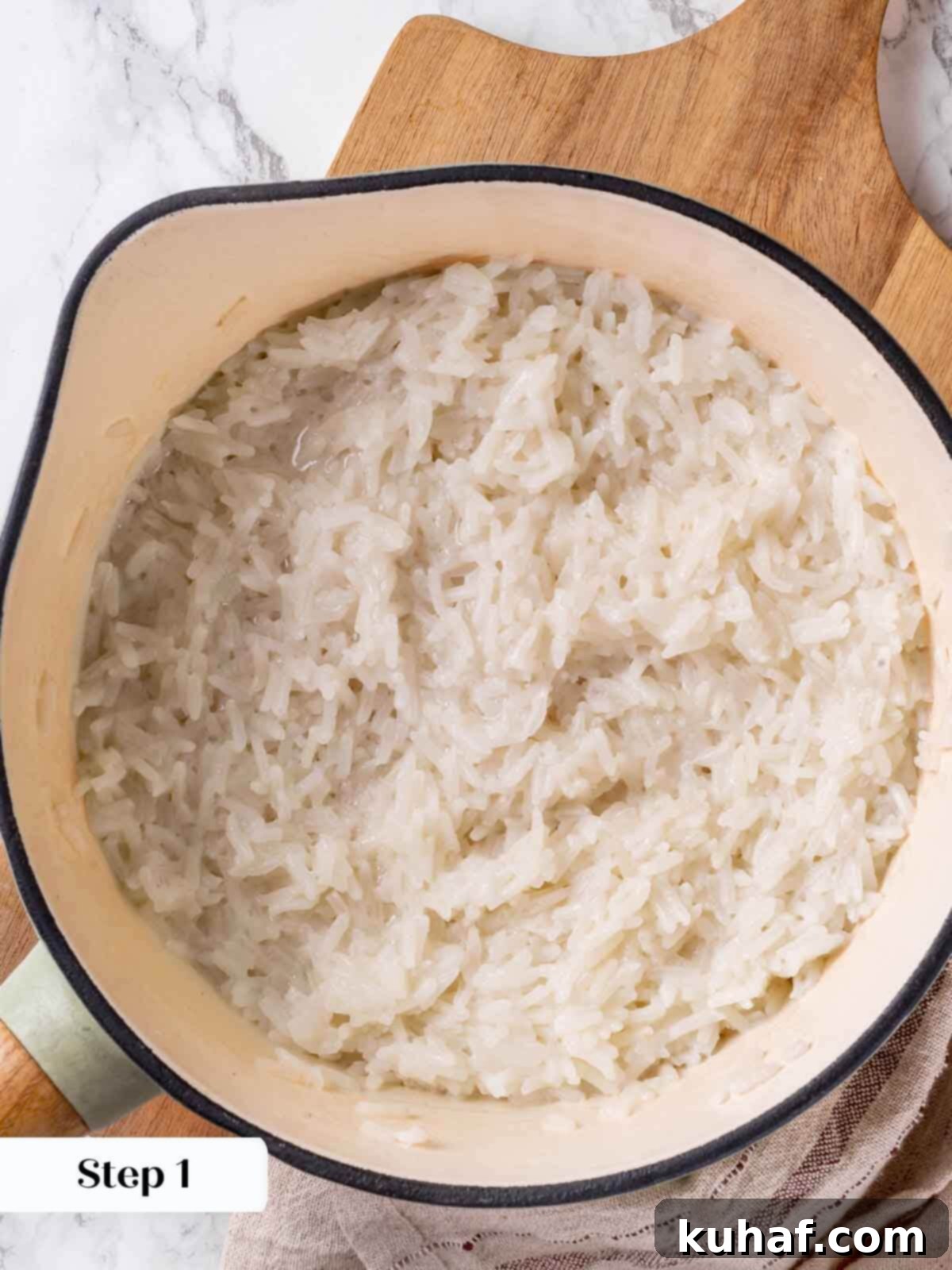 Fluffy cooked jasmine coconut rice, ready to be served with curry.