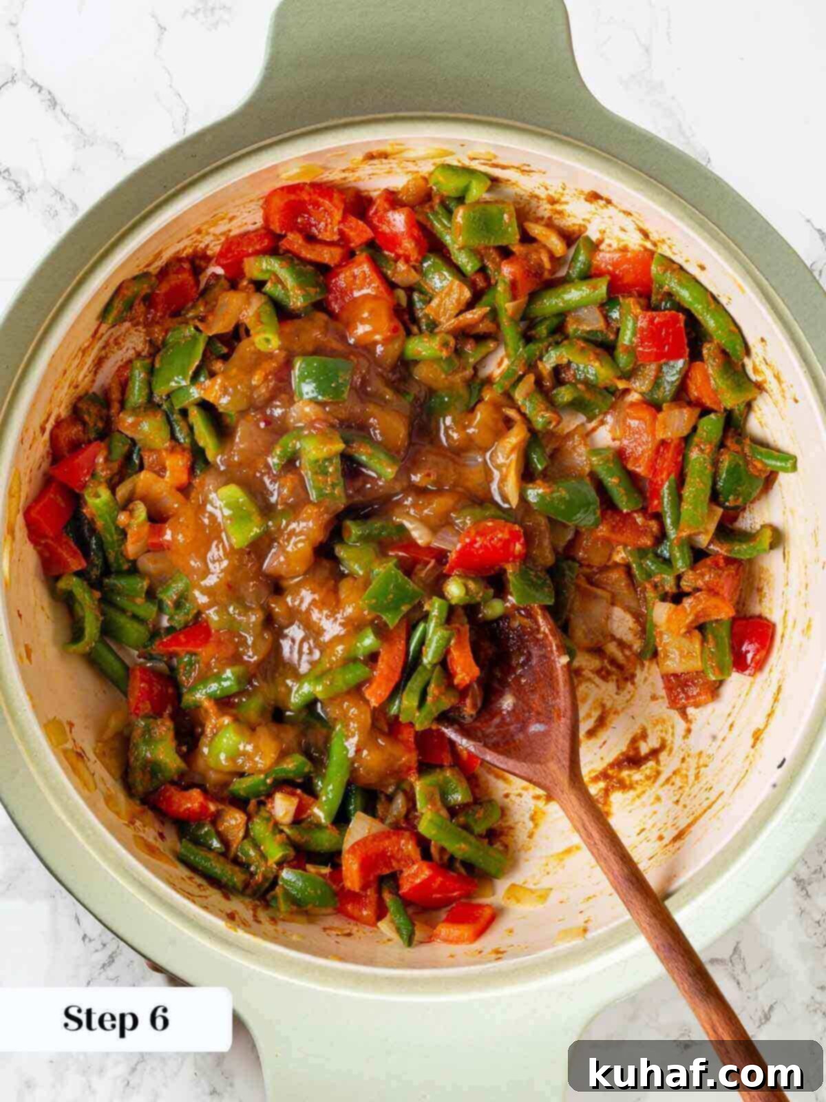 A close-up of the flavorful curry sauce simmering in a skillet before the shrimp is added.