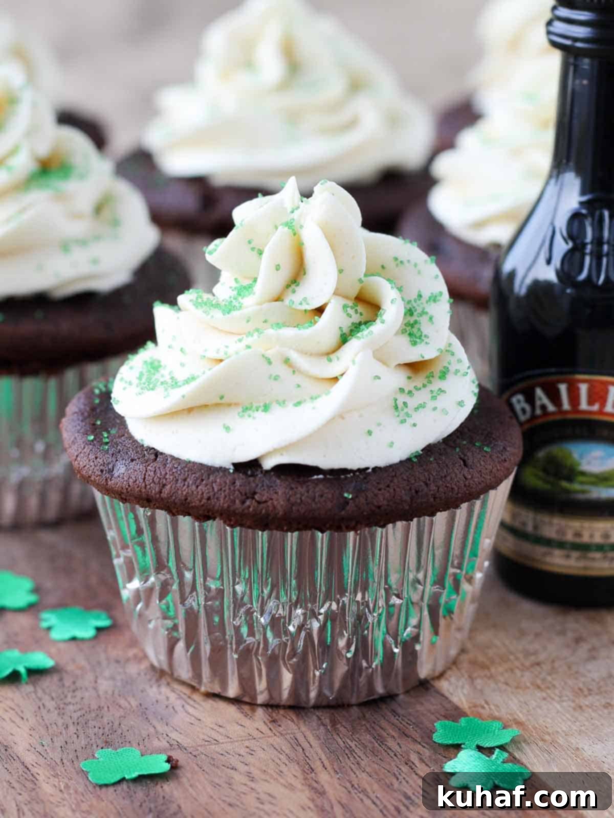 Shamrock Celebration Cupcakes 12 Delightful chocolate cupcakes topped with a swirl of Baileys buttercream and festive green sprinkles, ready for St. Patrick's Day celebrations.