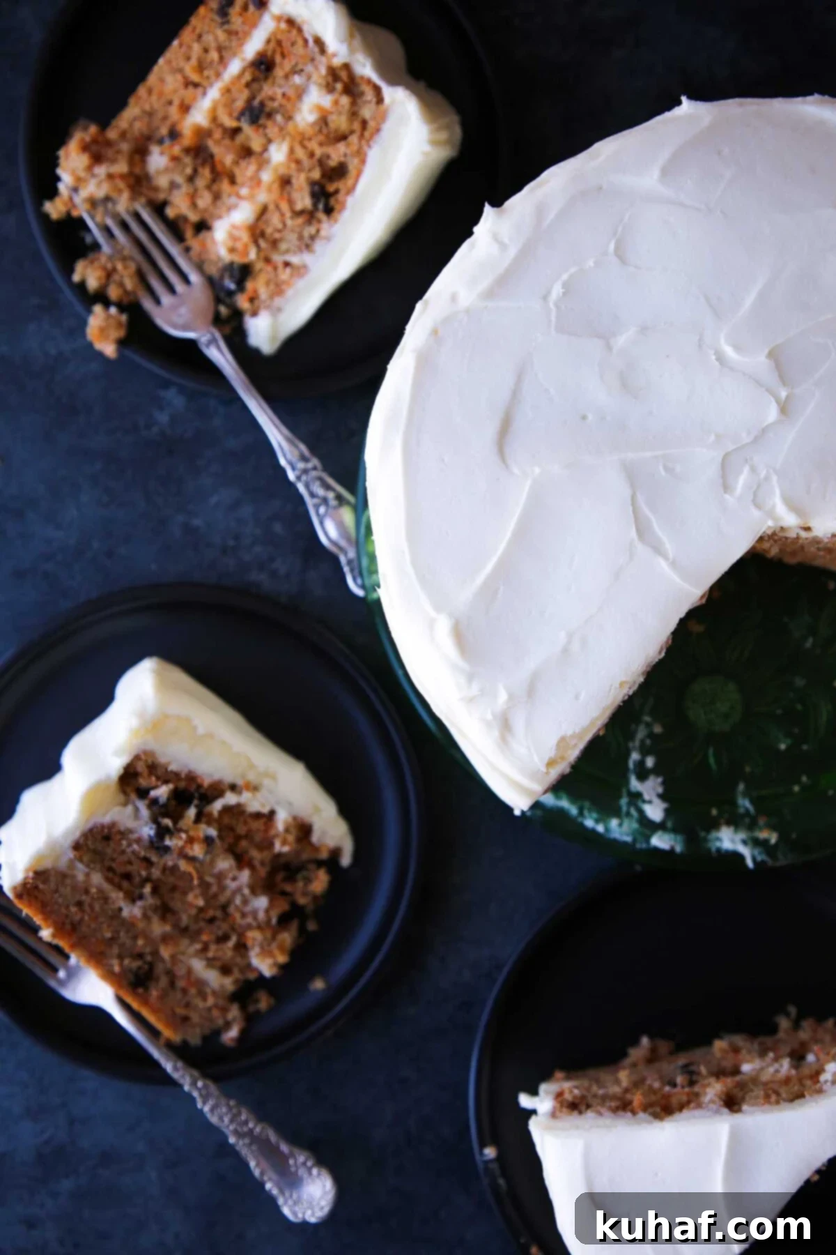 A perfectly sliced piece of moist carrot cake resting on a cutting board, ready to be served.