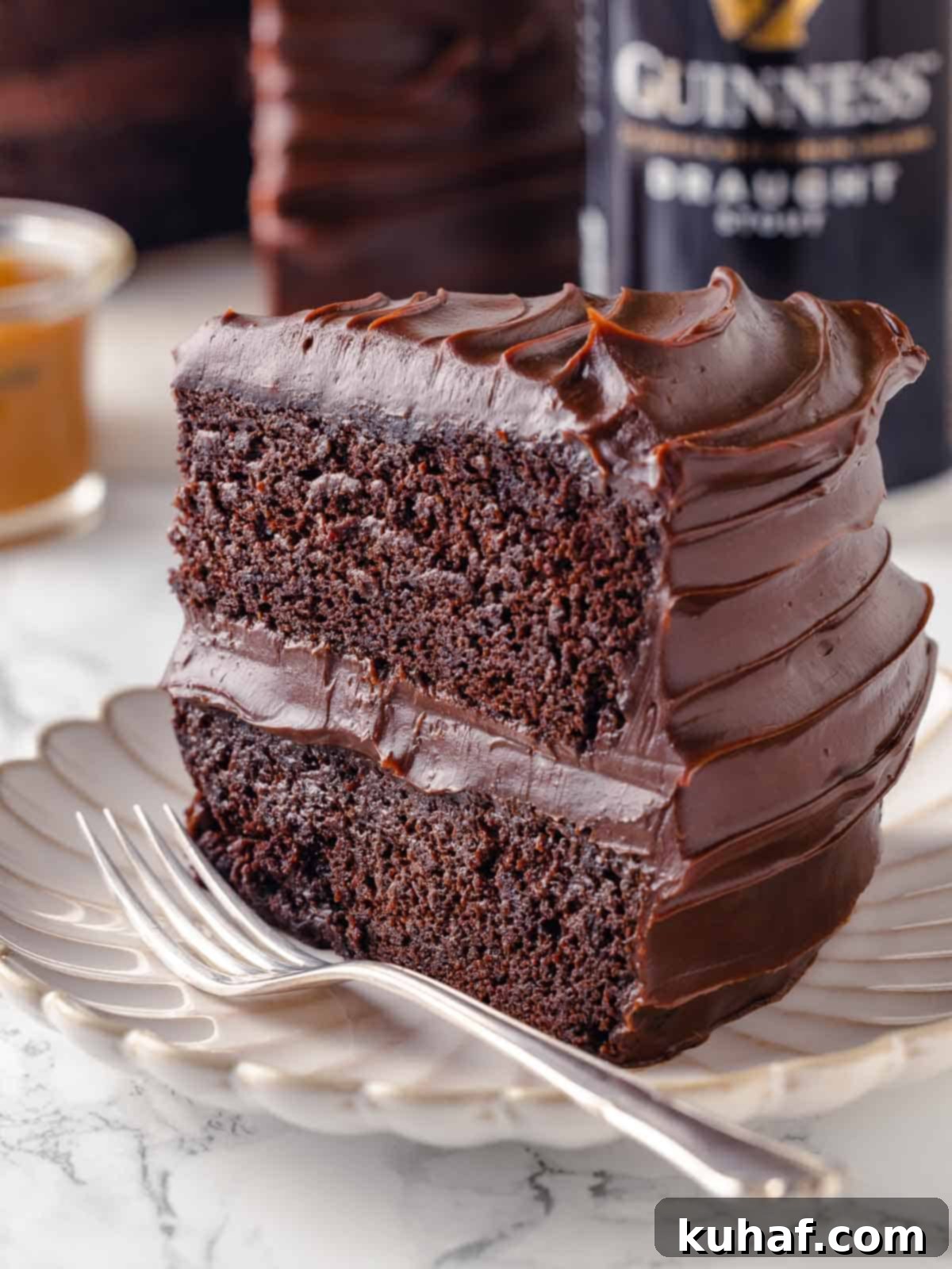 slice of guinness chocolate cake with two layers on plate.