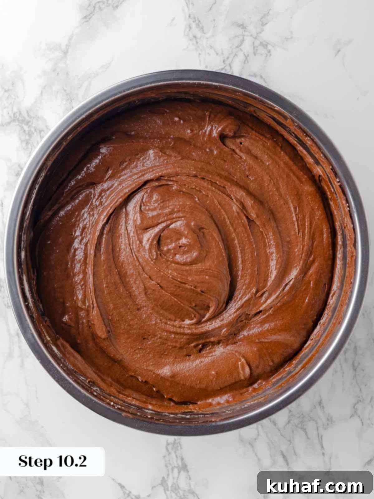 folding chocolate ganache mixture into cake batter.