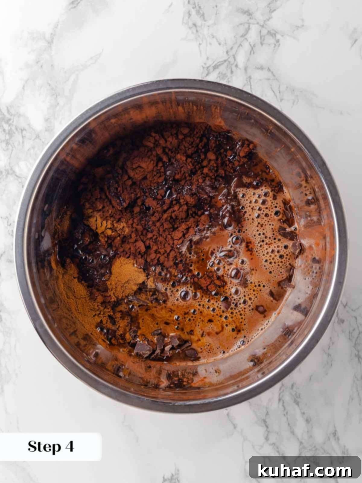 pouring boiling beer over chocolate and cocoa powder.