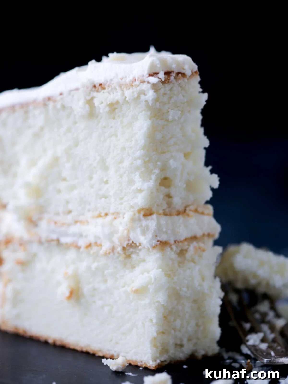 white cake slice with fluffy inside.